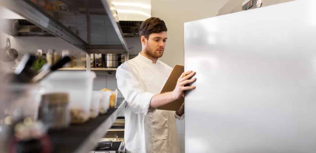 chef opening refrigerator door