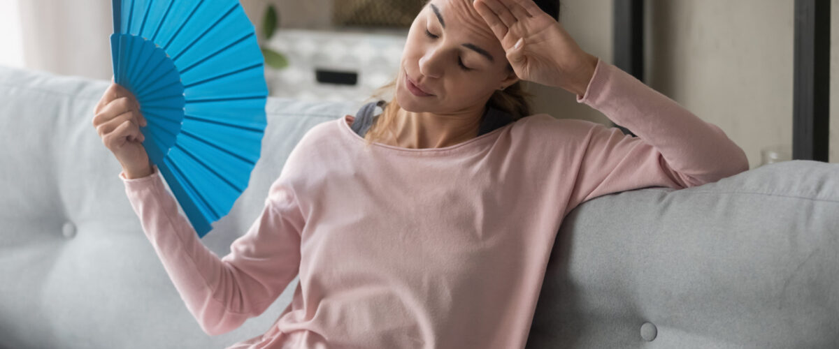 woman using blue fan