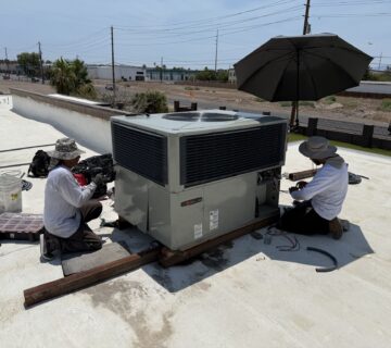 Legacy A/C technicians installing new unit