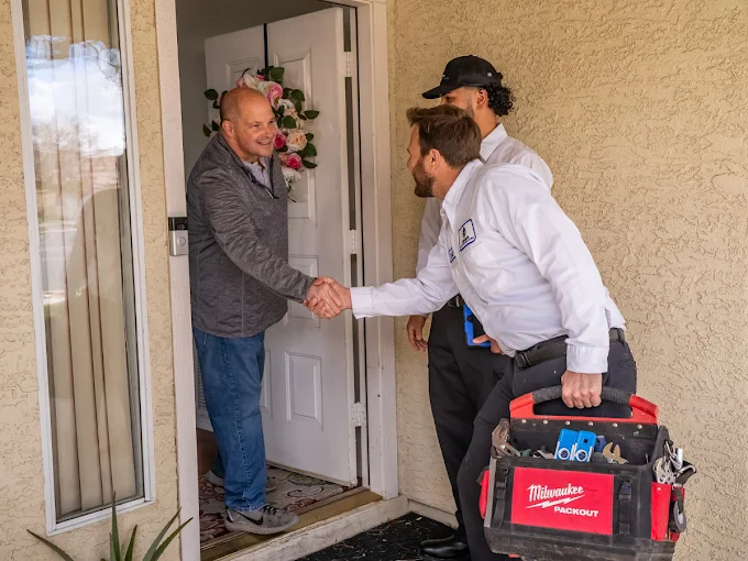 legacy hvac technicians greeting a customer upon arrival